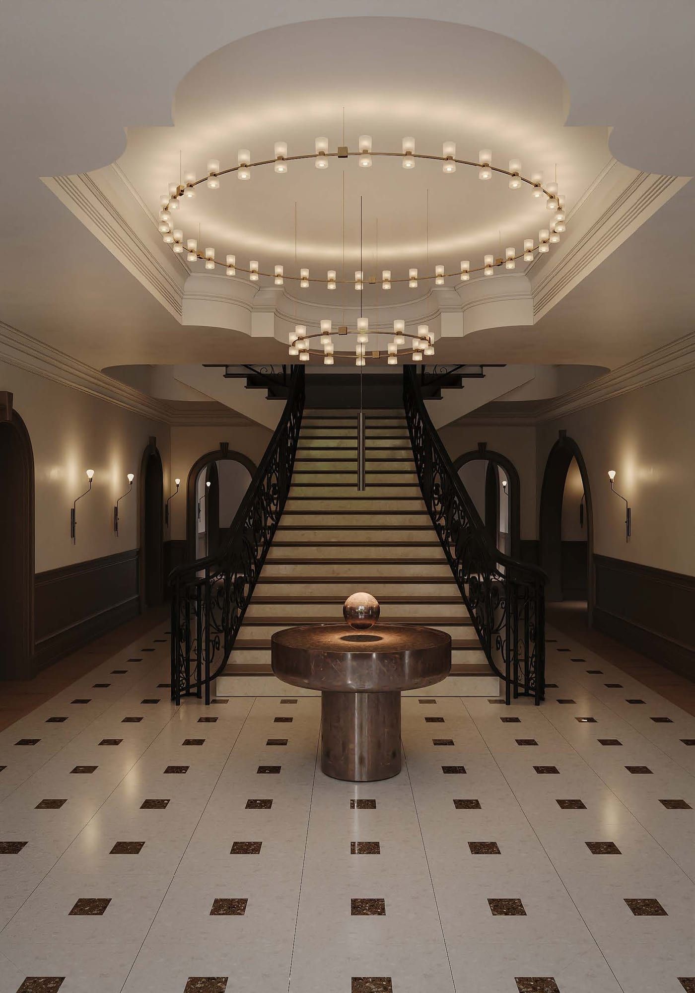 Entrance hall with a double staircase, iron balustrades and ring chandeliers